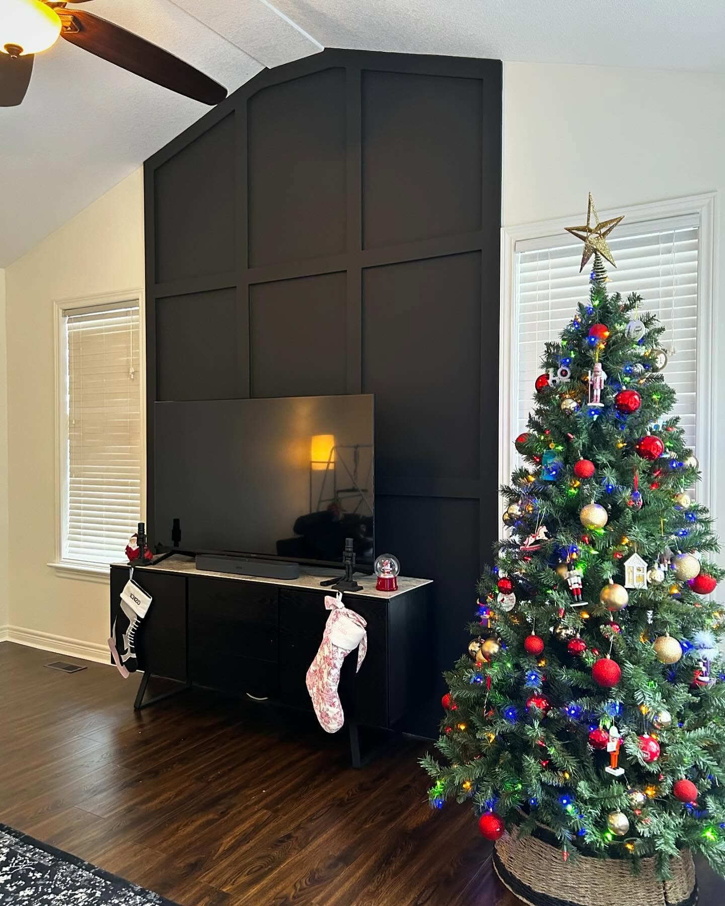 Custom black board-and-batten feature wall with vaulted ceiling