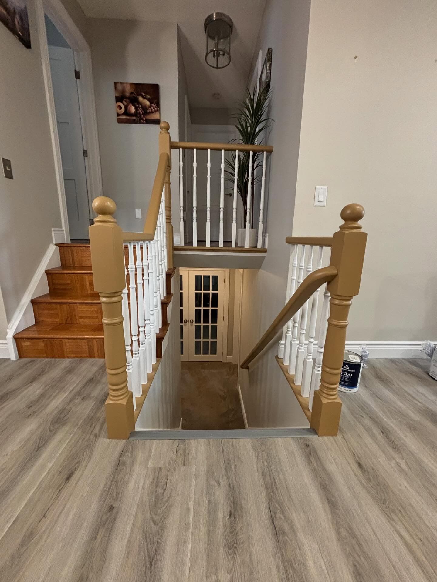 Refinished staircase with hardwood treads and painted railings