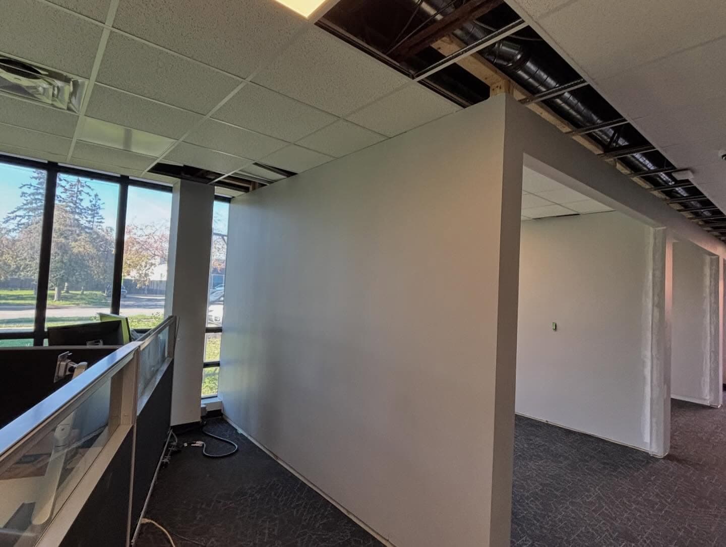 Commercial office build-out with finished partition walls