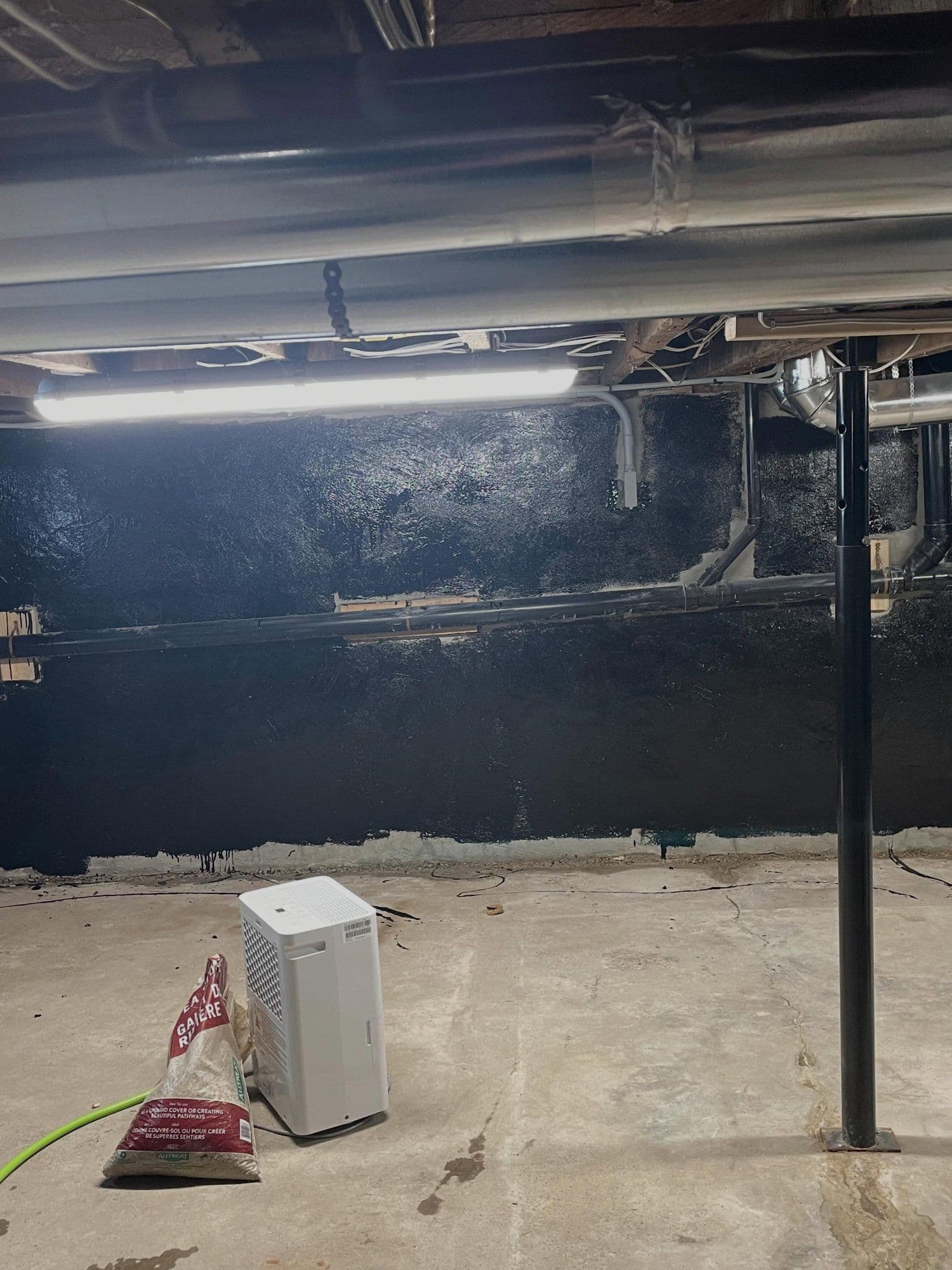 Damp unfinished basement before finishing
