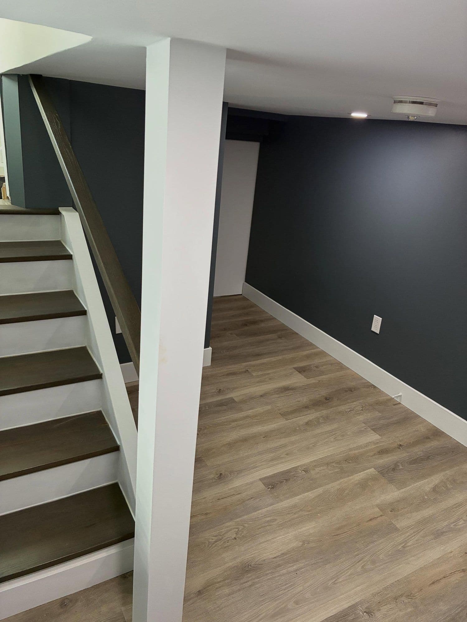 Finished basement with custom hardwood staircase